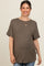 woman wearing a dark olive green short sleeve maternity top and showing her baby bump