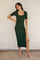 woman wearing a dark green ribbed midi dress with short sleeves and a side slit, posing against a neutral background