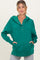 woman wearing a green maternity hoodie with a buttoned placket and front pockets