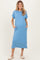 woman wearing a blue short sleeve maternity dress with pockets and a visible baby bump