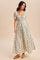 woman wearing a cream floral maxi dress with puff sleeves and a smocked bodice, styled with sandals and relaxed hair