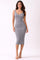 woman wearing a grey ribbed midi dress with a scooped neckline and fitted silhouette