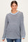 woman wearing a navy and light blue striped maternity top with long sleeves and side slits, featuring a relaxed fit