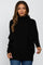 woman wearing a black oversized maternity sweater with a high neckline and long sleeves