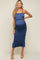 woman wearing a navy blue maternity midi dress with ruffles and spaghetti straps, showcasing her baby bump