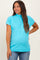 woman wearing a turquoise mock neck maternity top with short sleeves and relaxed fit, showing her baby bump
