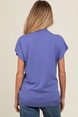 woman wearing a purple short sleeve maternity top, showing the back view with a relaxed fit