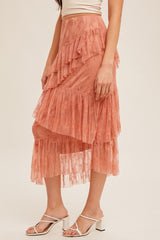 woman wearing a peach lace tiered midi skirt with ruffles and a flowy silhouette