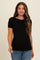 woman wearing a black short sleeve ribbed maternity top with a fitted silhouette and a round neckline
