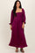 woman wearing a burgundy long sleeve maxi dress with a square neckline and puffed sleeves
