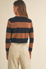 woman wearing a brown and navy striped long sleeve sweater, shown from the back with a relaxed fit