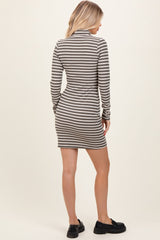 woman wearing a gray and white striped long sleeve mini dress, viewed from the back
