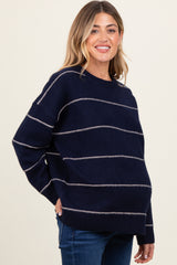 woman wearing a navy striped maternity sweater with a relaxed fit and baby bump visible