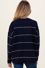 woman wearing a navy and cream striped maternity sweater, viewed from the back
