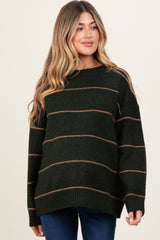 woman wearing a dark green striped maternity sweater with long sleeves and a relaxed fit