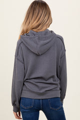 maternity wear in dark gray ribbed knit hoodie with a hood and relaxed fit, shown from the back