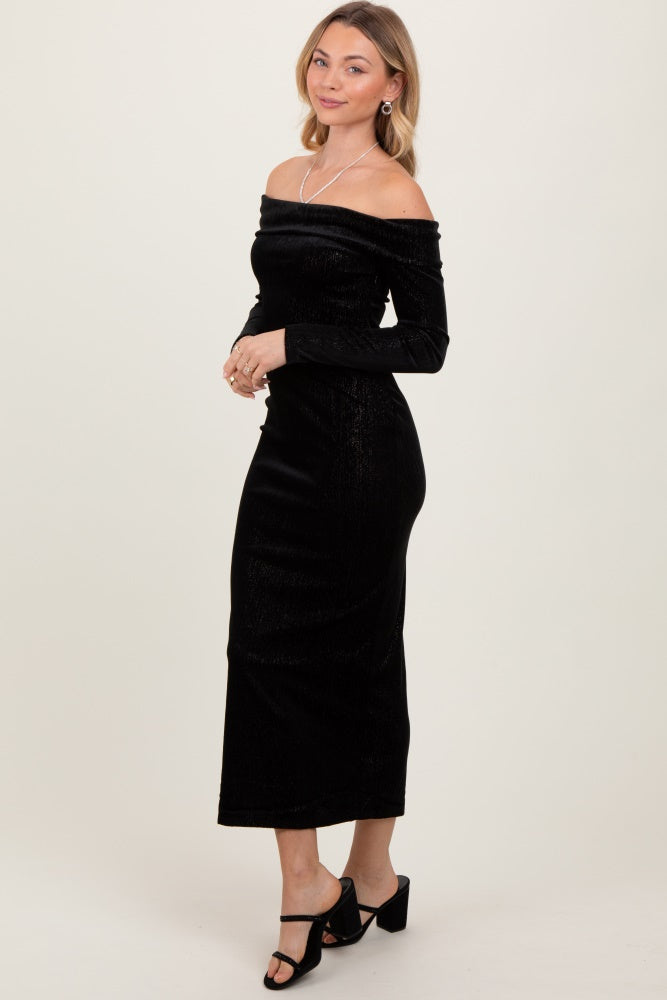 woman wearing a black off-the-shoulder midi dress with long sleeves and a fitted silhouette