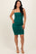 woman wearing a teal ruched bodycon dress with spaghetti straps and a fitted silhouette