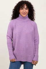 woman wearing a cozy lavender turtleneck sweater with ribbed detailing and relaxed fit