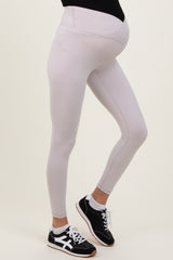 maternity wear light gray leggings with a supportive belly band, model wearing sneakers