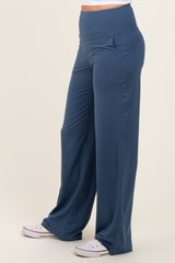 woman wearing navy blue wide-leg pants with pockets and a high waistband