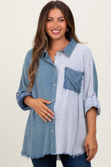 woman wearing a maternity oversized button-up shirt with denim and striped patterns, holding her baby bump