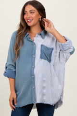 woman wearing a maternity oversized button-up shirt with blue and striped patterns and a front pocket, smiling and touching her hair