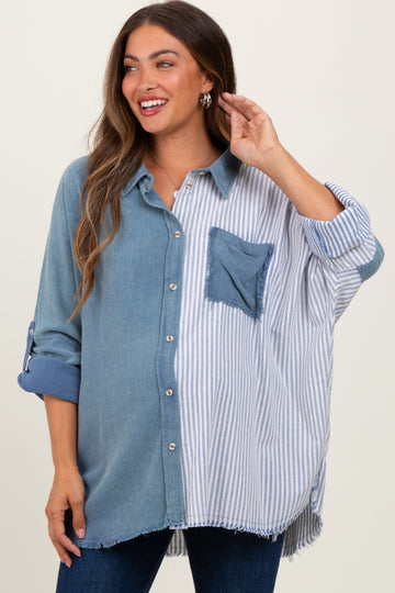 woman wearing a maternity oversized button-up shirt with blue and striped patterns and a front pocket, smiling and touching her hair