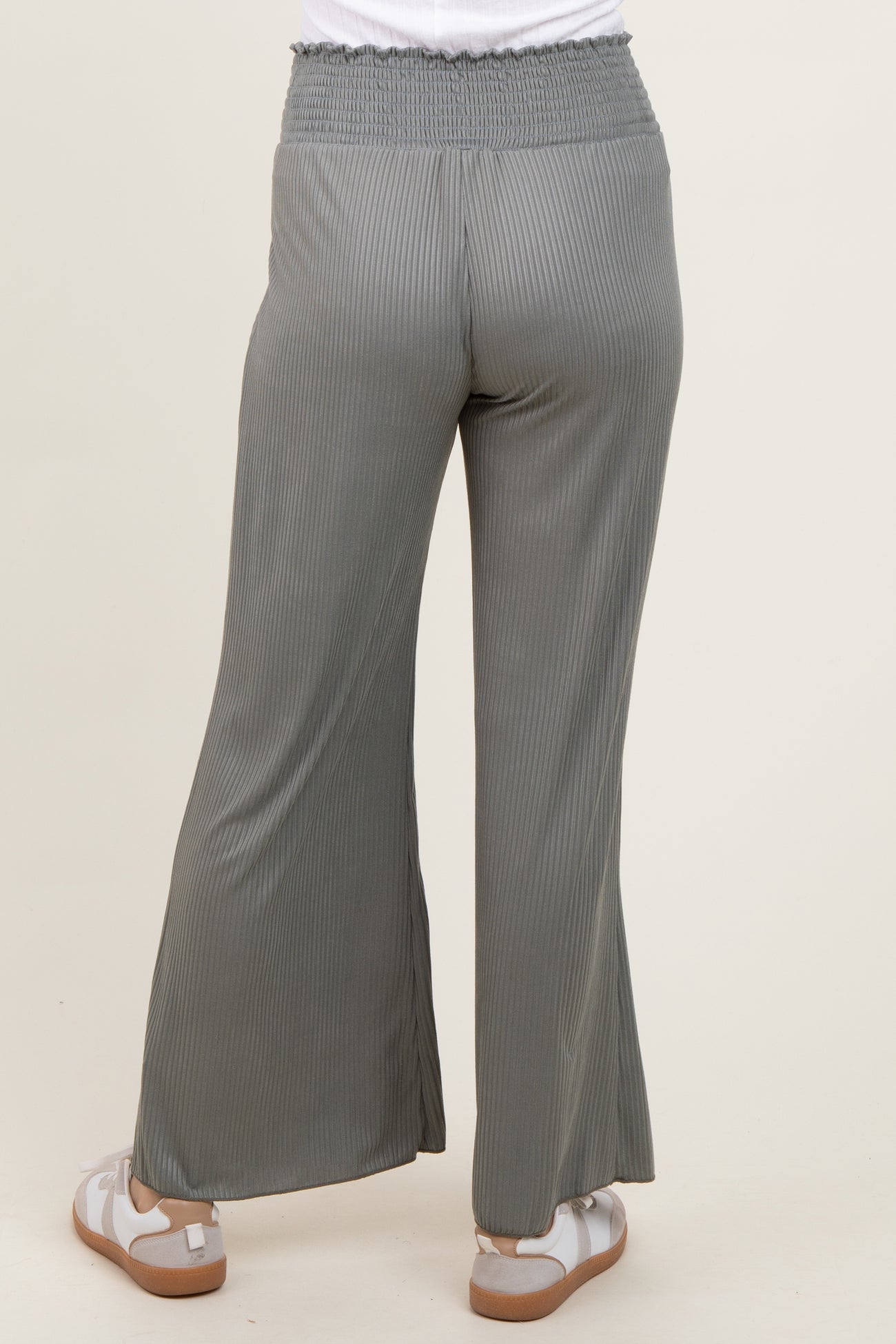 woman wearing light grey ribbed wide-leg pants with an elastic waistband, shown from the back