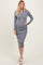 woman wearing a grey ribbed knitted midi dress with long sleeves and button details