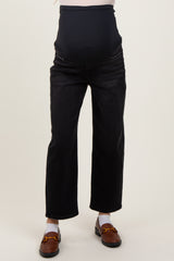 woman wearing black maternity jeans with a full belly band and relaxed fit