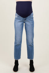 maternity wear blue skinny jeans with a thick navy belly panel, model wearing it with black ankle boots