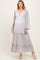 woman wearing a floral maternity maxi dress with a deep v-neck and balloon sleeves, highlighting her baby bump