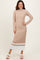 woman wearing a beige ribbed long sleeve midi dress with white stripes at the hem and smiling