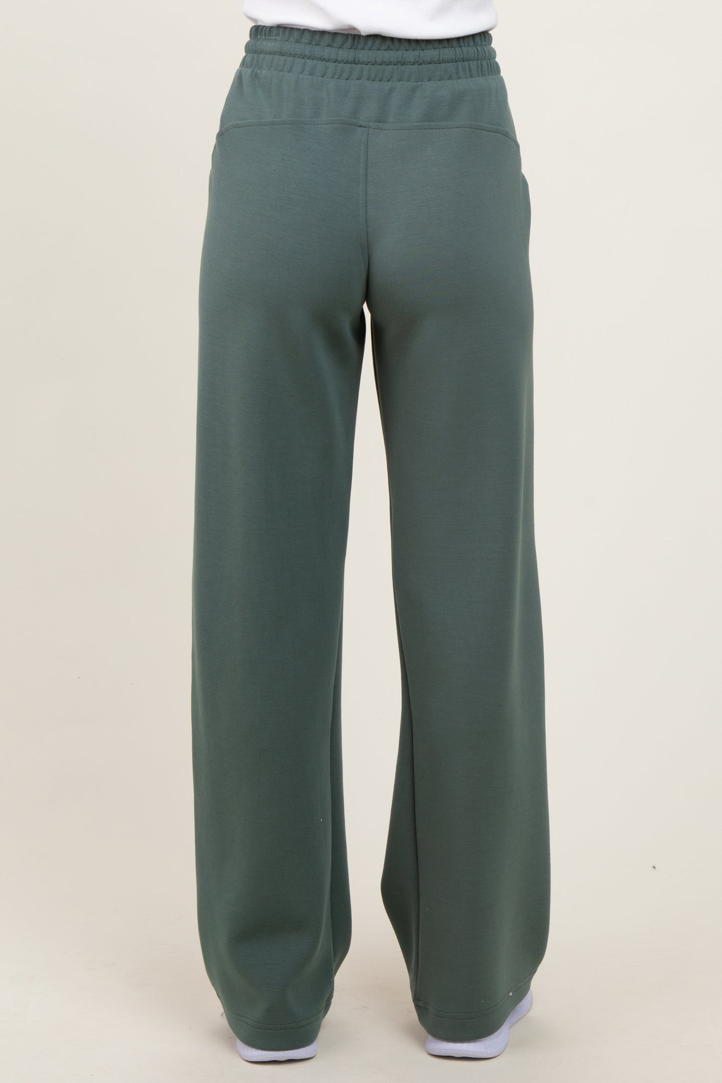 women's wide-leg green sweatpants with an elastic waistband and back pockets