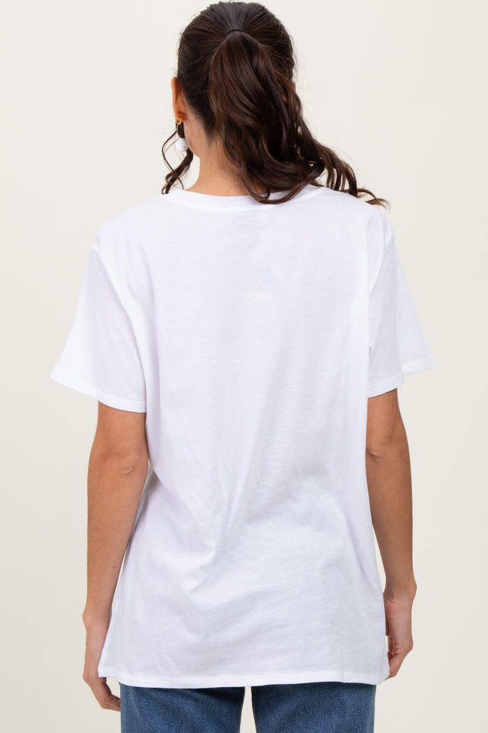 woman wearing a plain white oversized t-shirt, viewed from the back, paired with blue jeans