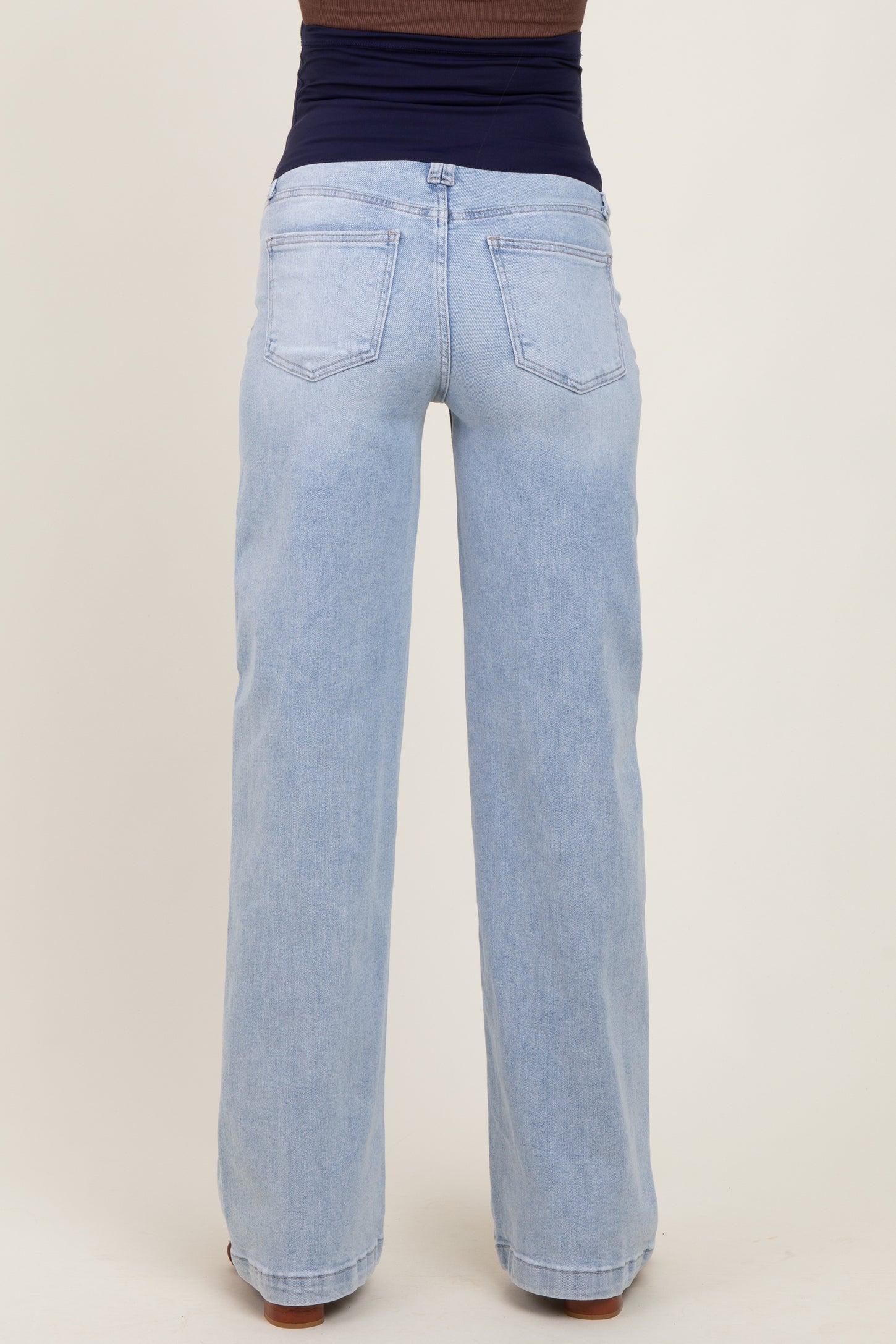 maternity wear light blue wide-leg jeans with a stretchy navy waistband