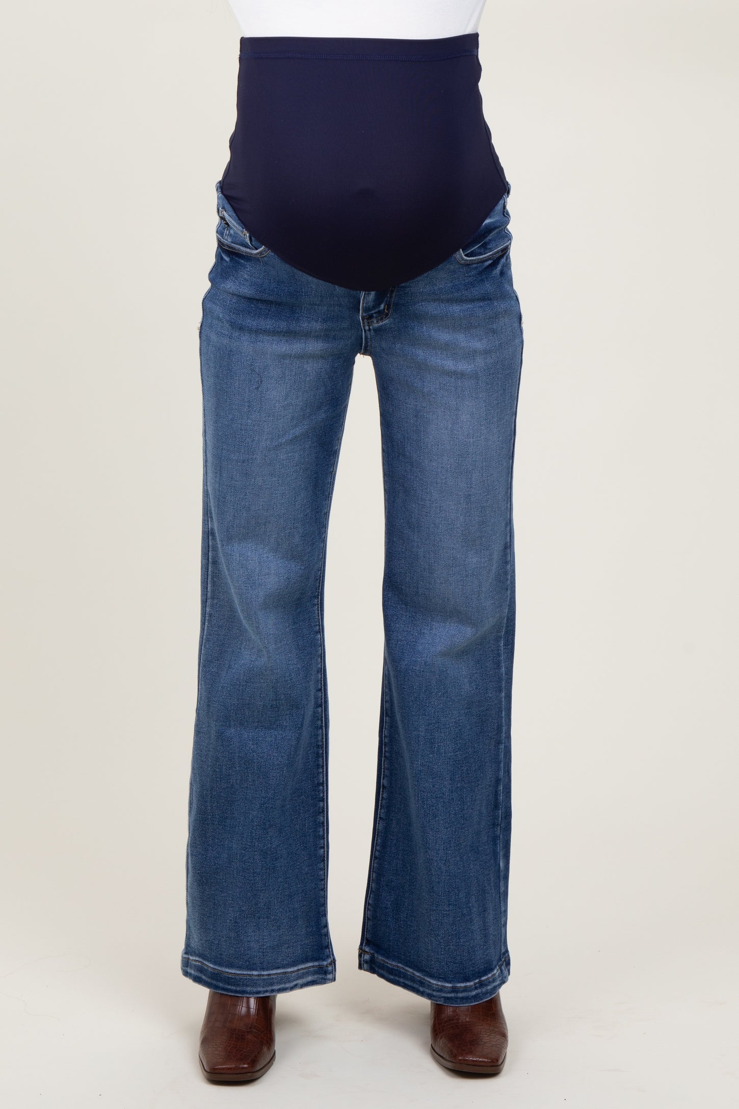 maternity wear dark blue flare jeans with a high waistband designed for comfort during pregnancy