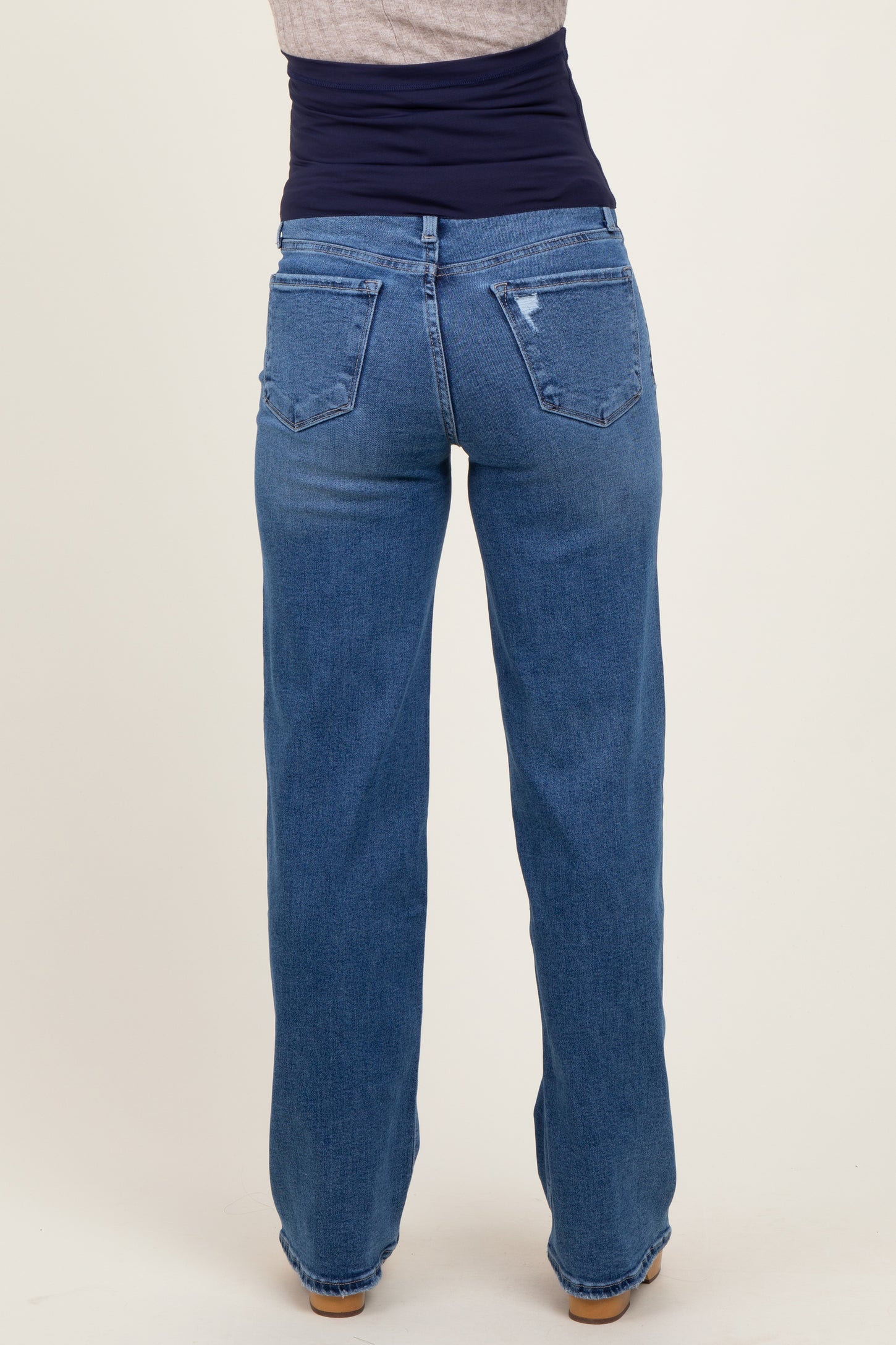 maternity wear light blue wide leg jeans viewed from the back