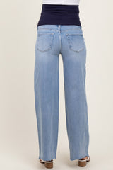 maternity wear light blue wide leg jeans with a black elastic waistband, shown from the back