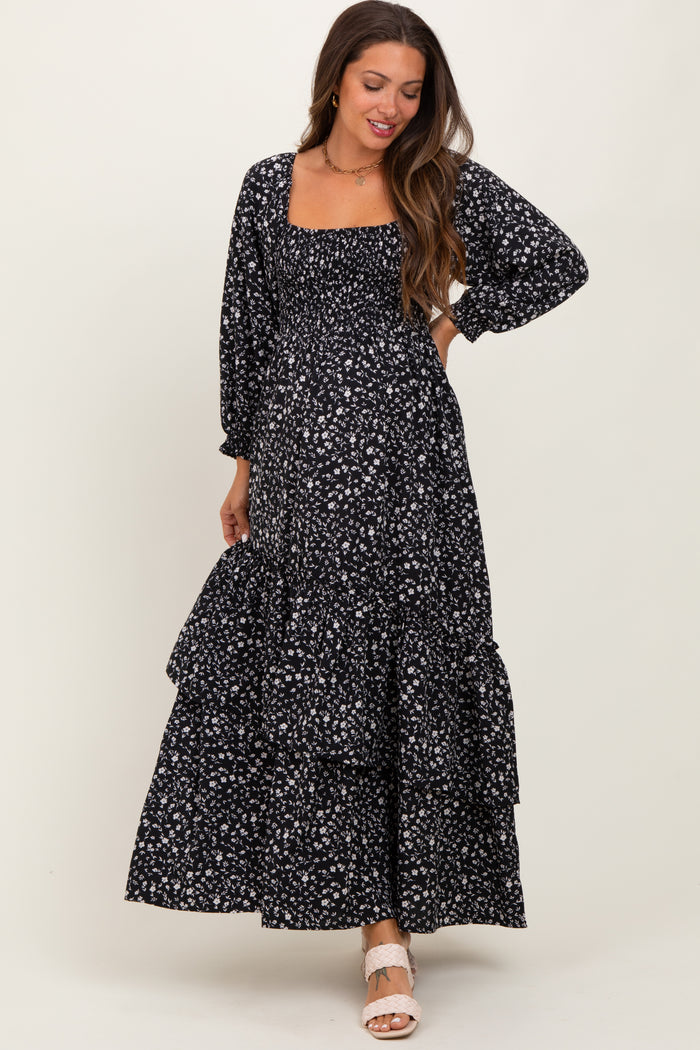 maternity wear black floral maxi dress with long sleeves and tiered skirt