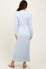 woman wearing a light blue ribbed long sleeve midi dress, view from the back