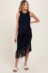 woman wearing a navy blue sleeveless knitted maternity dress with fringe detailing and a visible baby bump