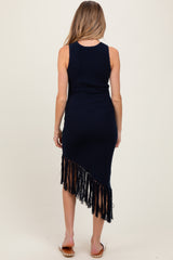 woman wearing a navy blue sleeveless maternity dress with fringe hem, showing her baby bump from the back