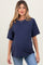 woman wearing a navy blue short sleeve maternity top with a pocket and baby bump visible