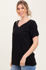 woman wearing a black v-neck t-shirt with short sleeves and relaxed fit