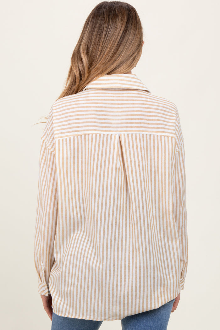woman wearing a beige and white striped maternity shirt, viewed from the back