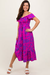 woman wearing a vibrant pink floral off-shoulder midi dress with smocked bodice and ruffled hemline