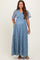 woman wearing a blue maternity maxi dress with flutter sleeves and floral embroidery, showcasing her baby bump