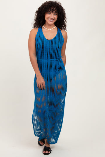 woman wearing a deep blue open-knit maxi dress with a tie waist and a v-neckline